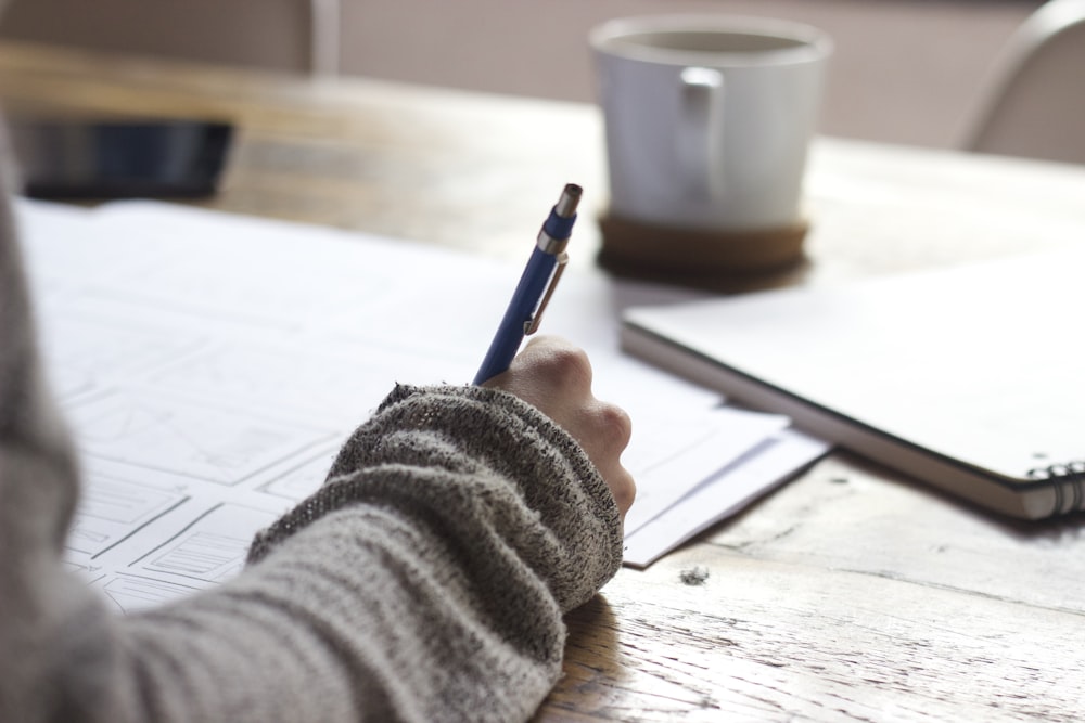 Person studying notes and planning healthy habits
