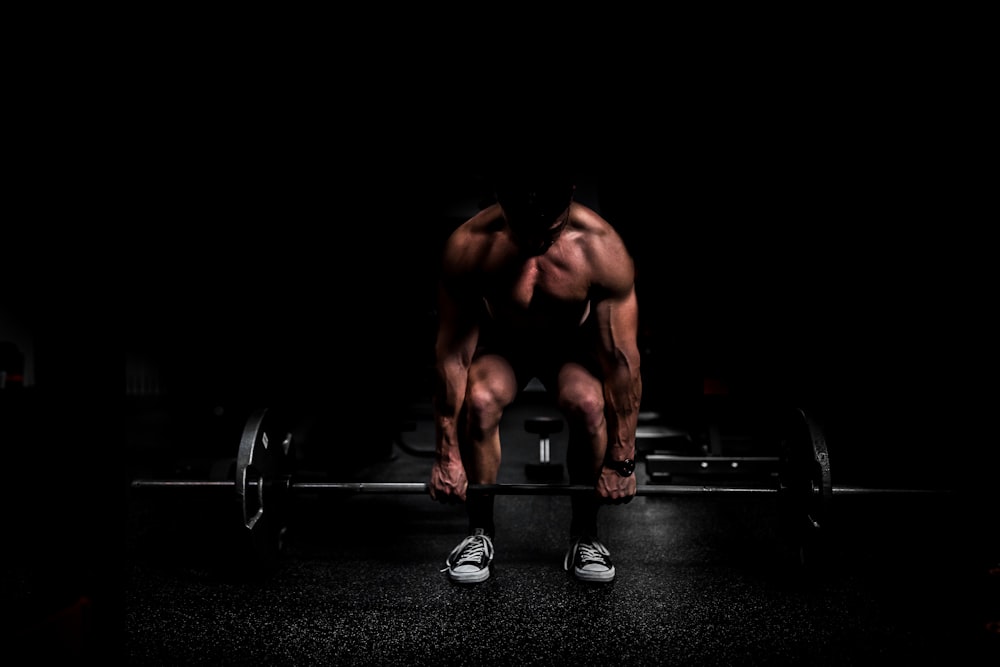 Person training with weights to build muscle protein